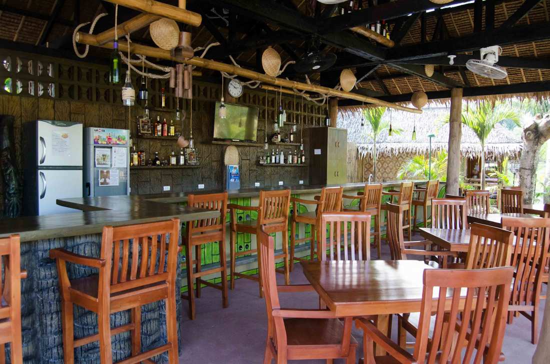 Open-air restaurant under a thatched roof
